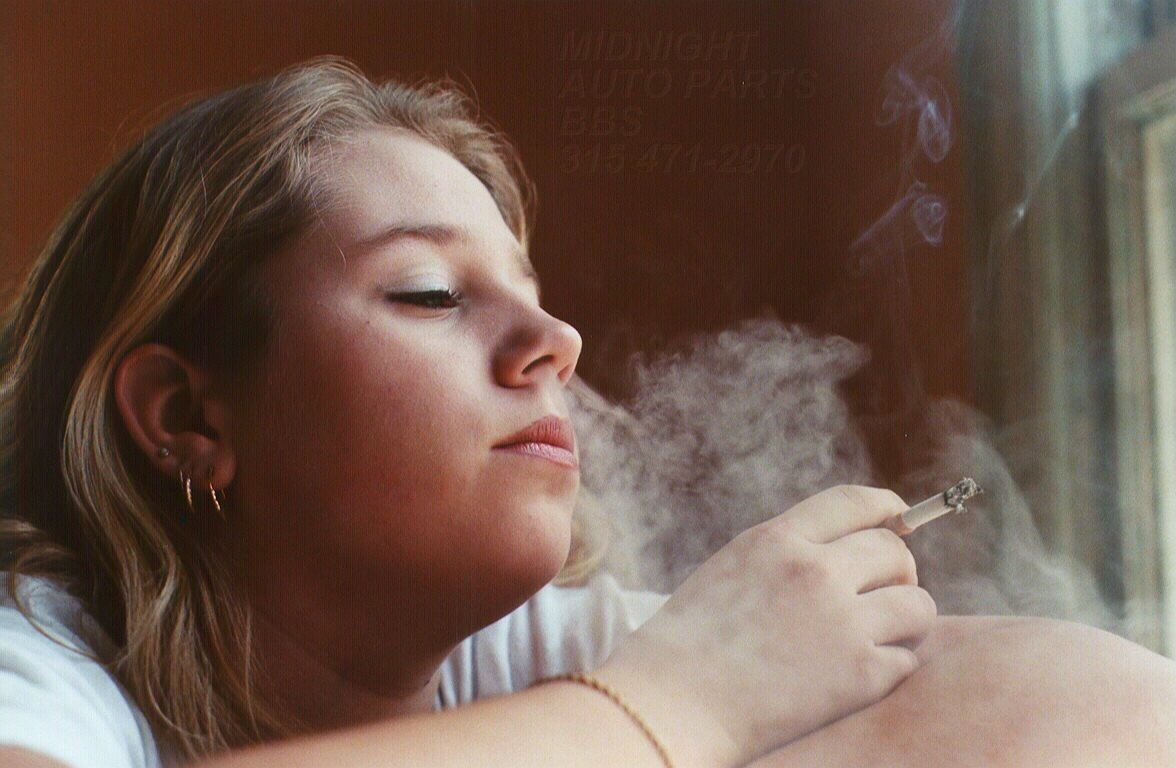 Girls smoking nose exhales