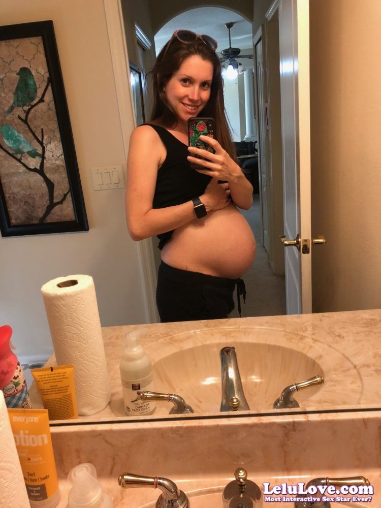 Pregnant rubbing belly